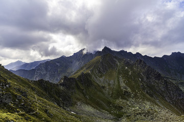 Obraz premium Landscape with rocky mountain peaks in summertime
