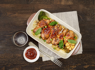 grilled chicken legs with sesame on  plate 