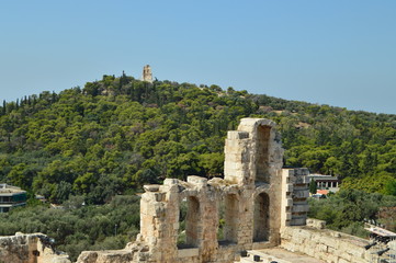 Monument to Philopapos, on the top of the hill Philopapos Seen From The Acropolis Of Athens. Architecture, History, Travel, Landscapes. July 9, 2018. Athens Greece.
