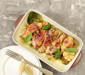 grilled chicken legs with sesame on  plate 