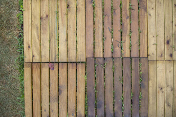 image with a high shot of wooden tiles for paving from external gardens