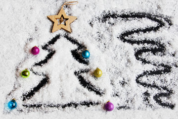 Christmas background with snow and Christmas tree decorations.