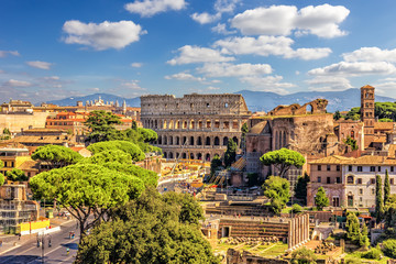Fototapeta na wymiar The Colosseum and Roman Forum from the Vittoriano, summer shot