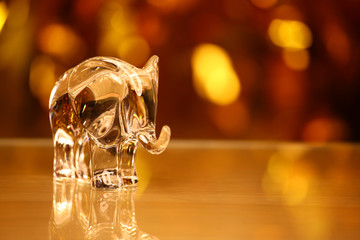 Glass Elephant figure Wax Gold bokeh reflection