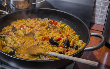 horizontal image with food detail of paella preparation