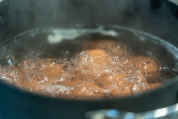 Eggs Boiling in Water