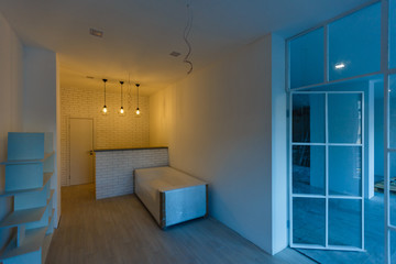 Interior empty office light room with without furniture in a new building renovation or under construction.Glass doors and Windows.