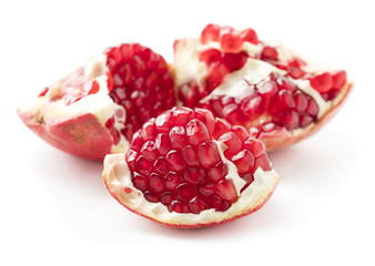 pieces of ripe pomegranate isolated on whtie background