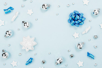 Christmas decorations on blue background with empty copy space for text. Holiday and celebration. Flat lay, top view