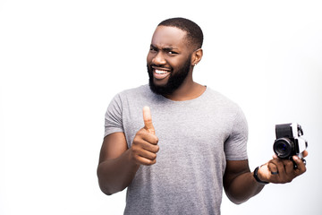 The affirmative gesture and emotion of an African American man, fond of technique. He is testing...