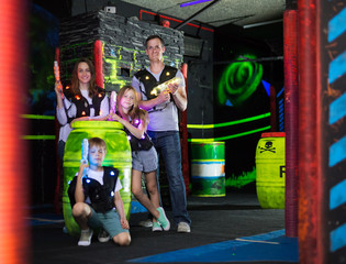 Fototapeta premium Kids and parents with laser guns