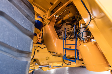 Engine compartment in a giant yellow dump truck