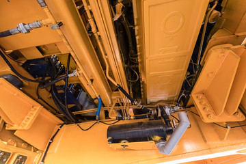 Engine compartment in a giant yellow dump truck