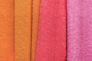 Samples of fabric - guipure with paillettes of different colors on the display case