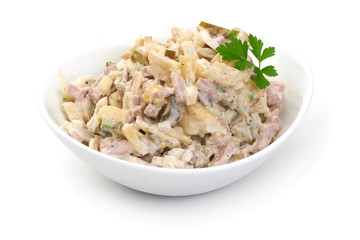 Russian traditional salad Olivier with vegetables and meat. Winter salad.