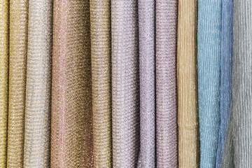 Samples of fabric -  knitwear with lurex of different colors on the display case
