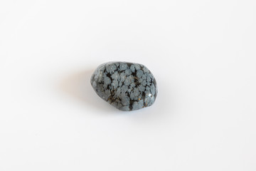 Obsidian isolated on white background, treated stone