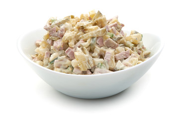 Russian traditional salad Olivier with vegetables and meat. Winter salad.