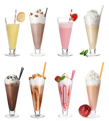 Set with different delicious milk shakes on white background