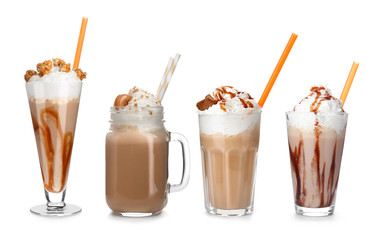 Set with delicious caramel milk shakes on white background