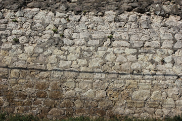 Part of old grey stone wall