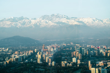 Fototapeta premium Urban sprawl in the city of Santiago in Chile with the Andes Mountains in the background