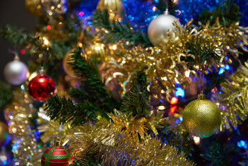 Obraz na płótnie Canvas Ornaments on a Christmas Tree. Medium shot of decorations on a Christmas tree.