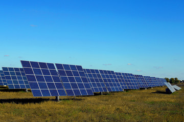 Solar panels against the blue sky, ecological power station.