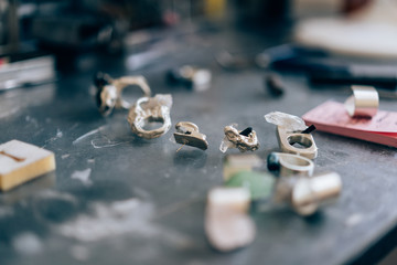 Different jewelery on the table from the jeweler from a close angle