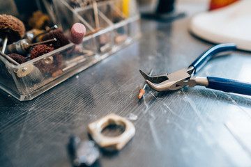 Different jewelery on the table from the jeweler from a close angle