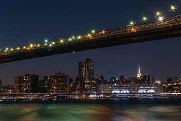 brooklyn bridge and manhattan at night
