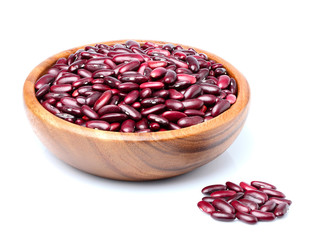 Red beans in wooden bowl isolated.
