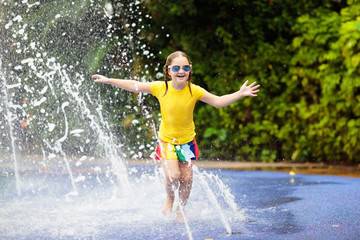 Kids at aqua park. Child in swimming pool.