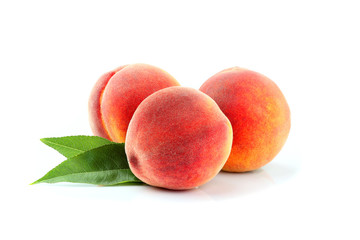 Fresh peach fruits with leaf isolated.