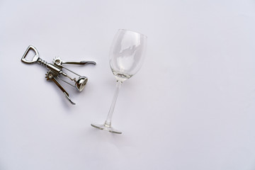 Glass of wine and corkscrew