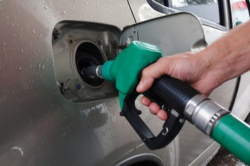 Gas station. Filling cars with gasoline at the station.