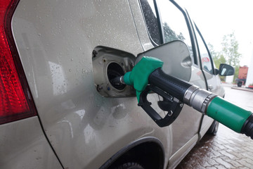 Gas station. Filling cars with gasoline at the station.