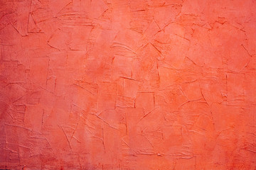 Coral color plastered wall texture background