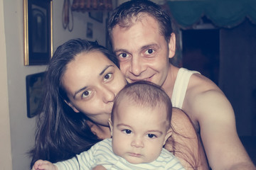 Mother father and baby enjoying nice evening together