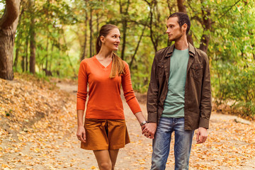 Couple walking in autumn park