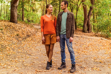 Couple walking in autumn park