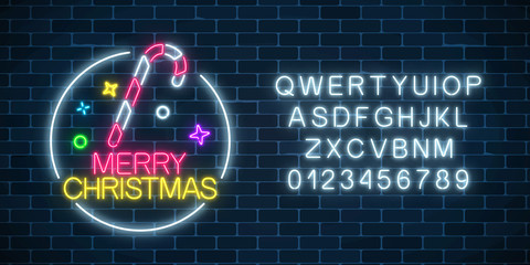 Glowing neon christmas sign with christmas candy cane and alphabet. Christmas symbol web banner in neon style.