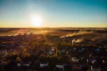 Aerial view of countryside village panorama in autumn sunset