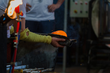 Glassworks glass manufacturing, process of forming a decorative product.