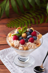 Frozen creamy ice yoghurt with berries and nuts
