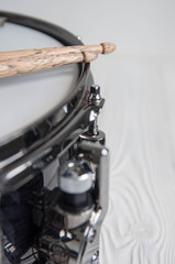 Fototapeta na wymiar Musical instruments close up. Beautiful snare drum with drummer holding drumsticks 
