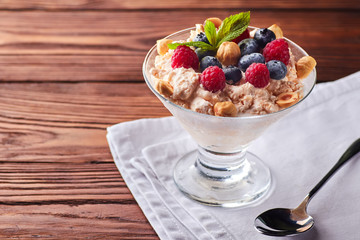 Frozen creamy ice yoghurt with berries and nuts