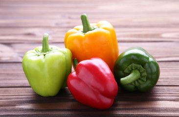 Fresh colorful pepper on a brown background