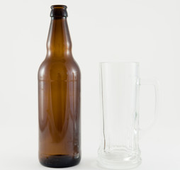 beer bottles with glass cup on white background