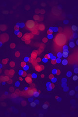 Colorful bokeh lights on blue vertical background